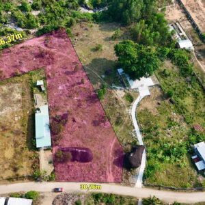Aerial view of a land parcel outlined in purple with dimensions 66.37 m by 30.26 m and area 4,528.4 m2, including 400 m2 residential, surrounded by trees and houses.